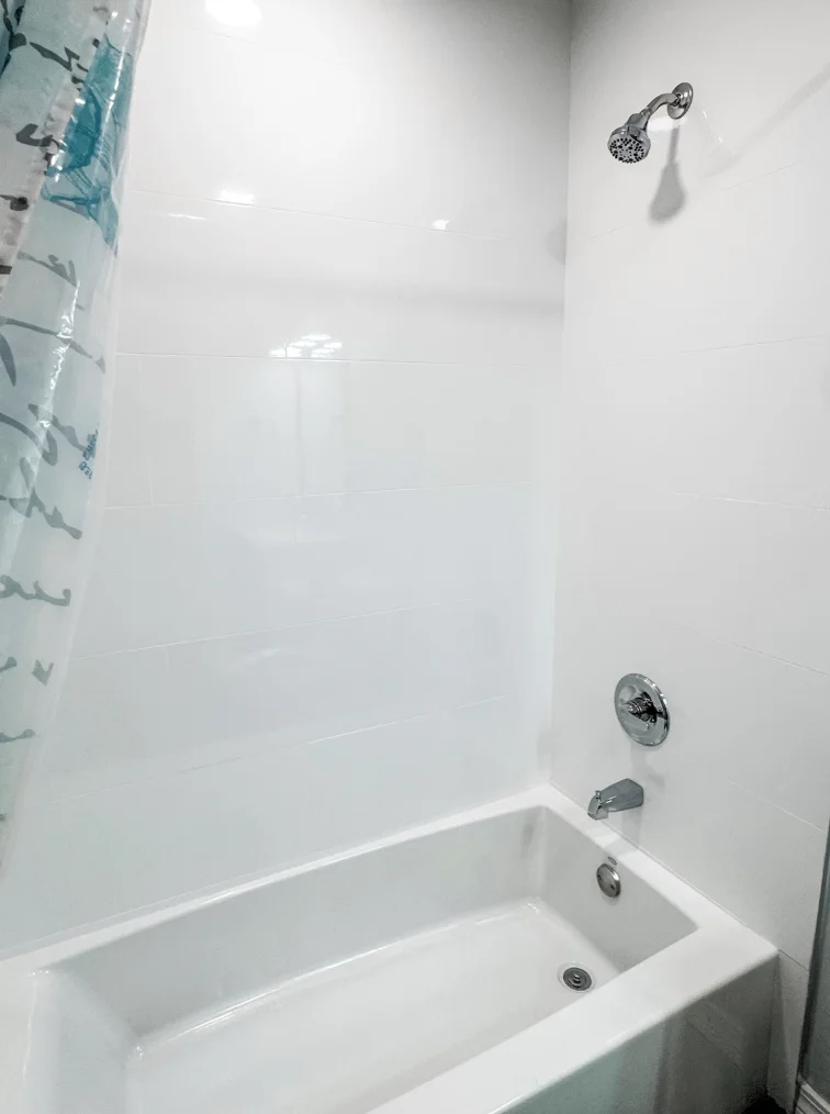 This newly updated guest bathroom features a tub/shower combination
