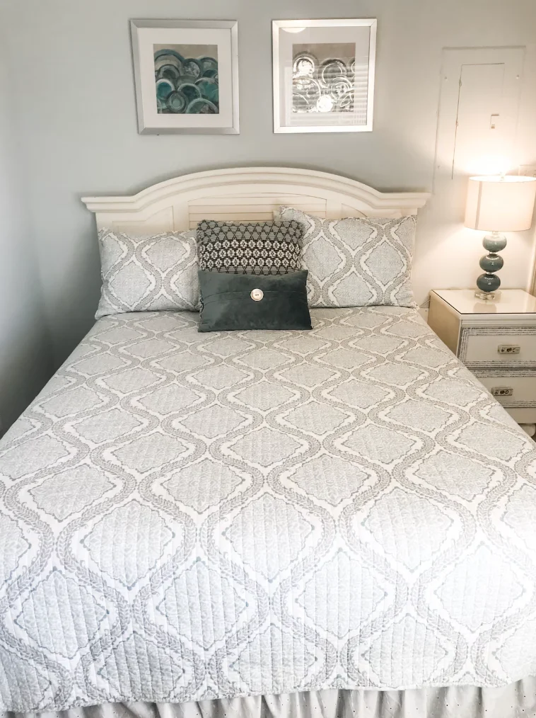 The guest bedroom features a queen size bed