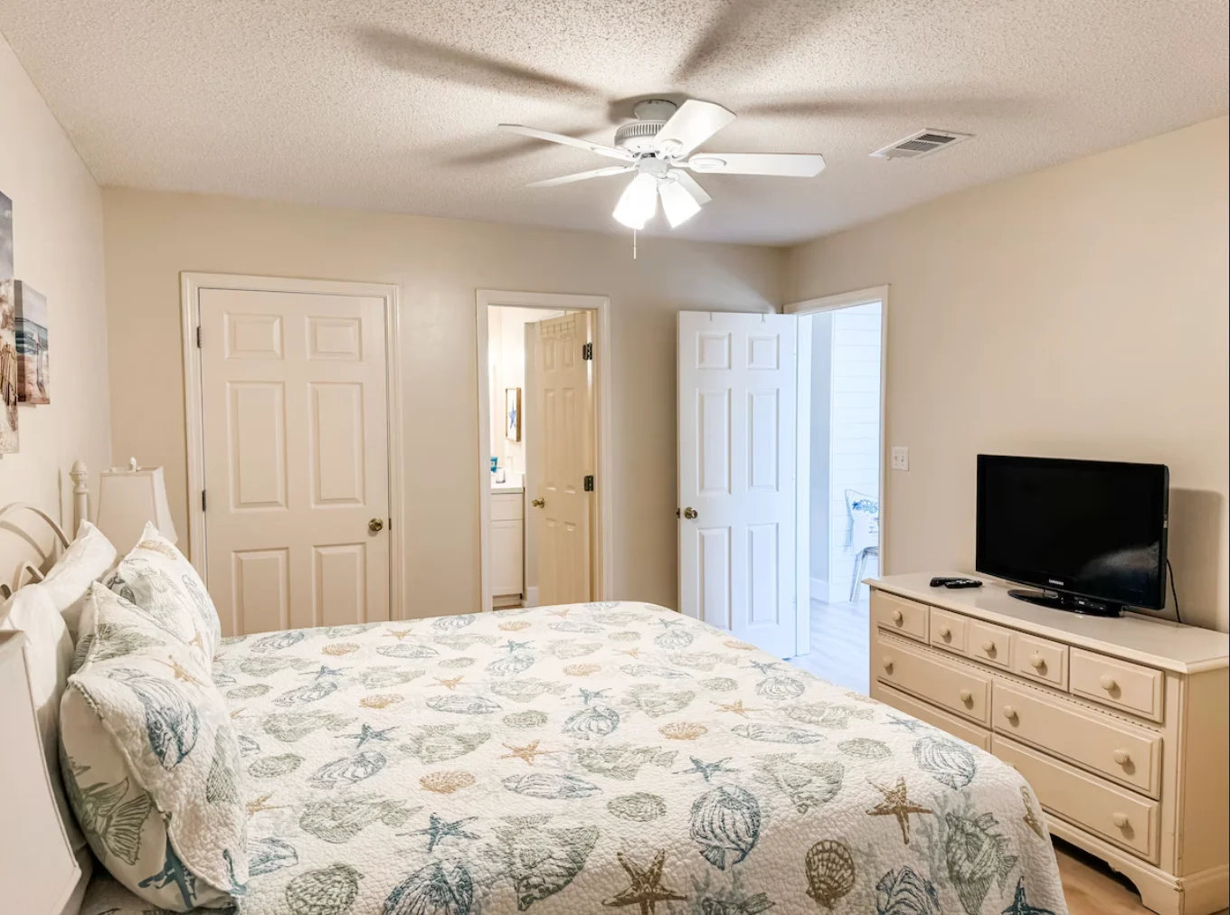 The first bedroom on the left is our guest bedroom with a king size bed & TV.