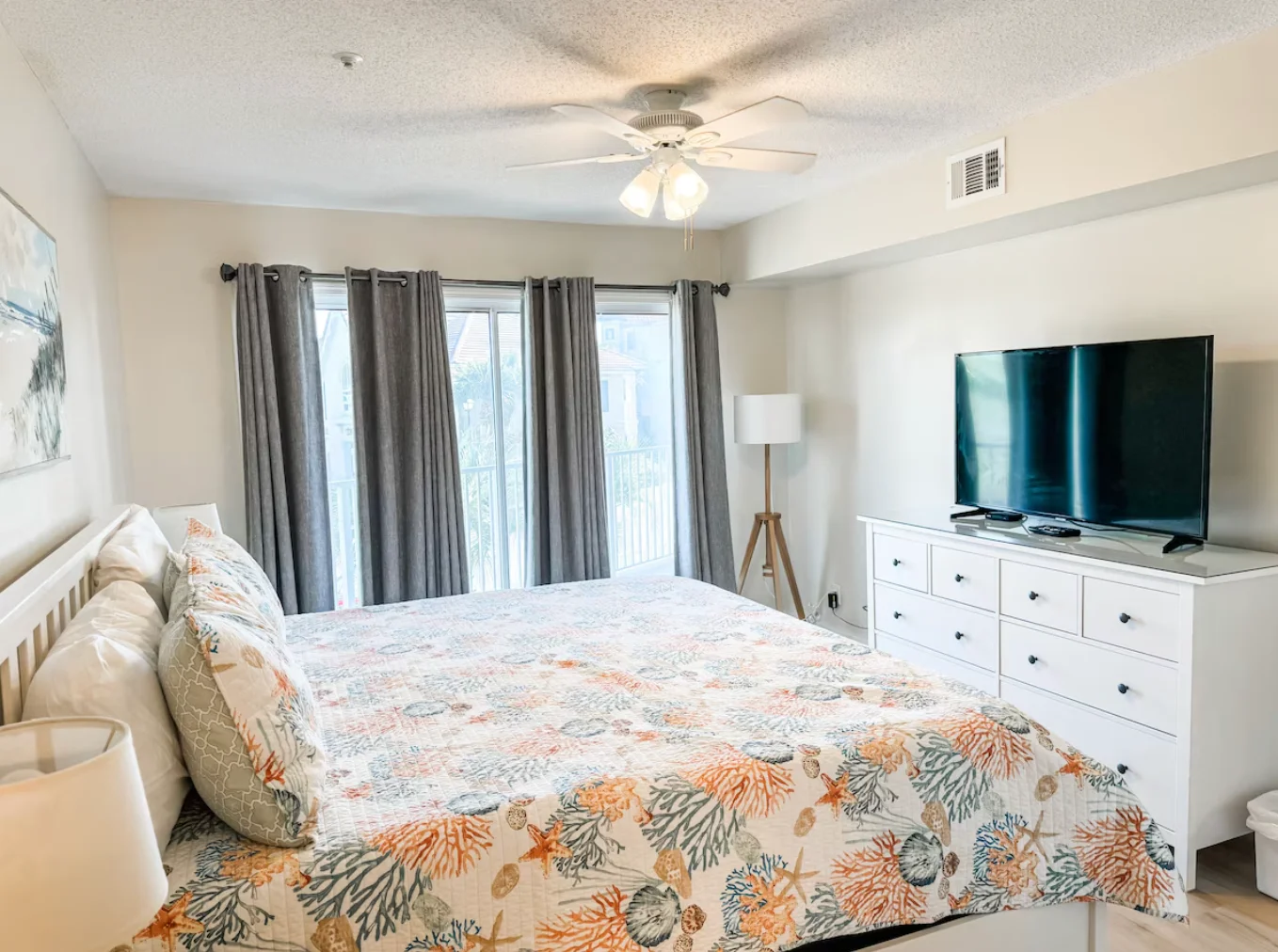 The primary bedroom also has access to the balcony through sliding glass doors. Primary bedroom has its own private bathroom connected to the room & TV.