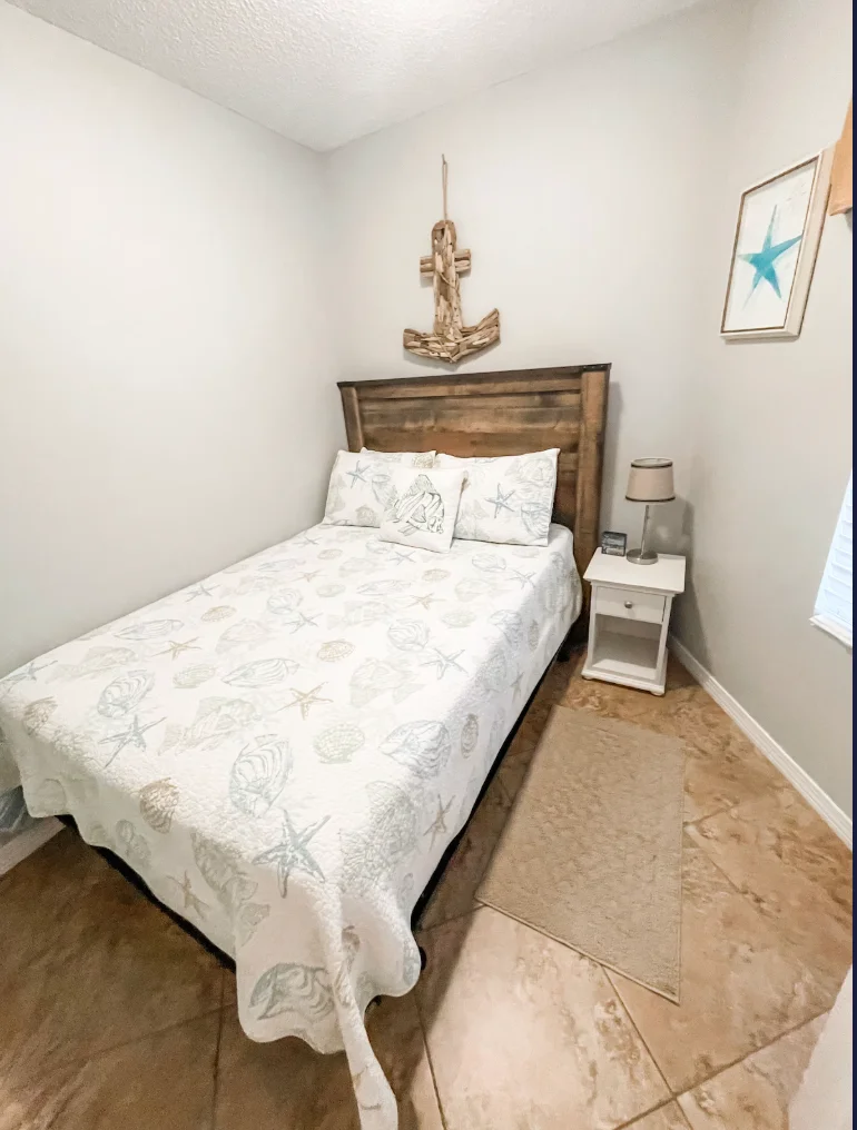 The third bedroom features a full size bed and a Smart TV