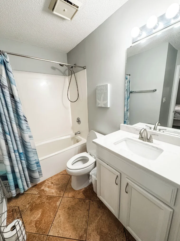 Guest bathroom has a tub/shower combination