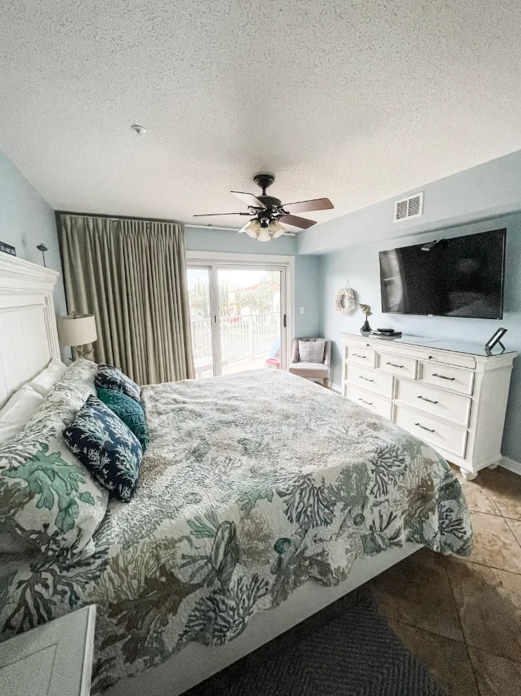 Still the main bedroom but with a different bedspread and new TV