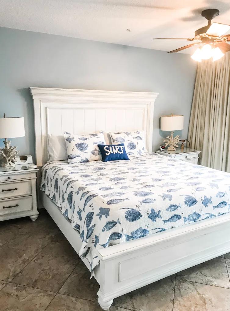 Main Bedroom equipped w/ king-size bed, two side tables, a dresser, TV & more