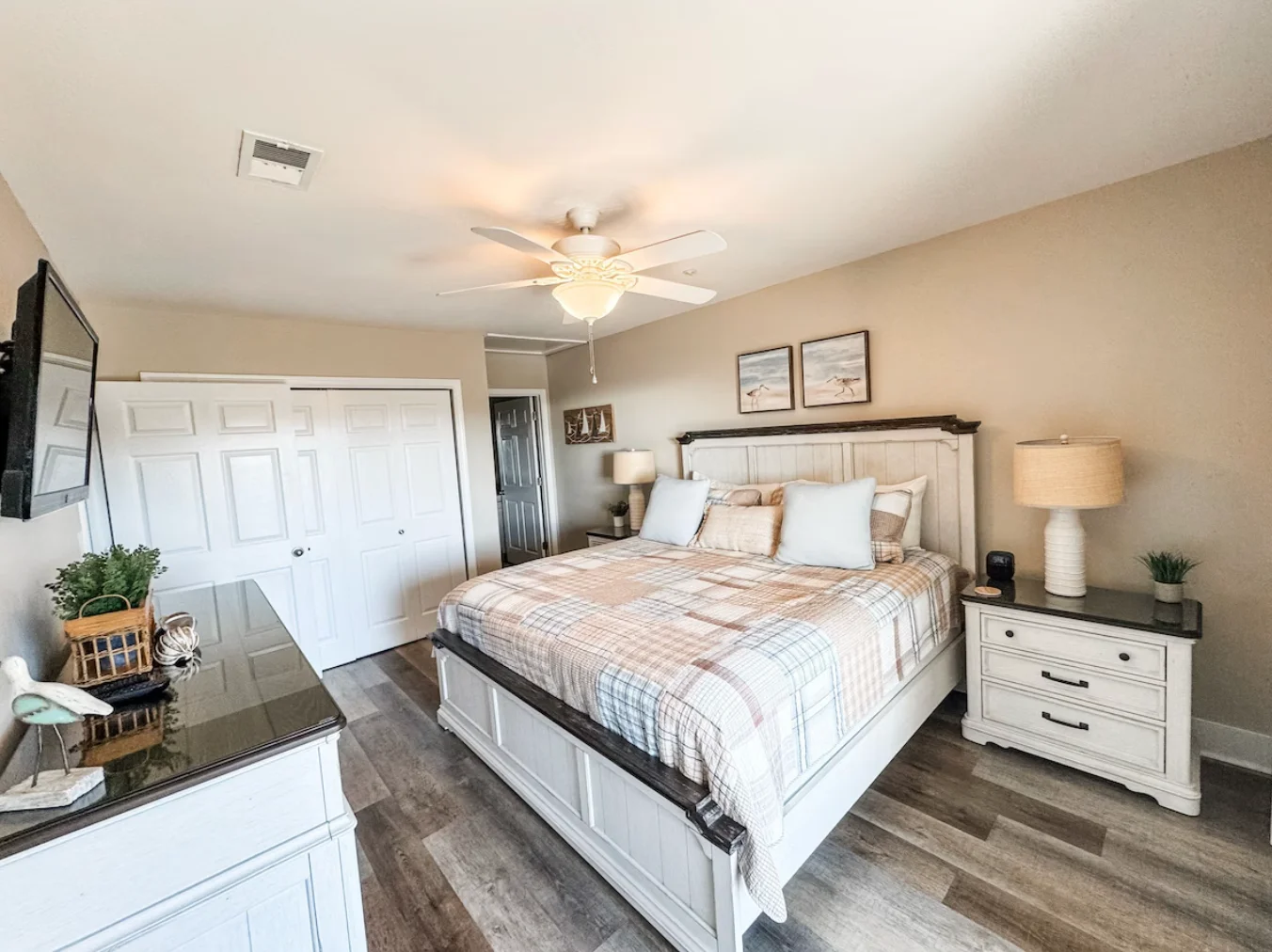 Here is a another view of the main bedroom's TV, dresser, and desk. Main/primary bedroom also has an ensuite bathroom.