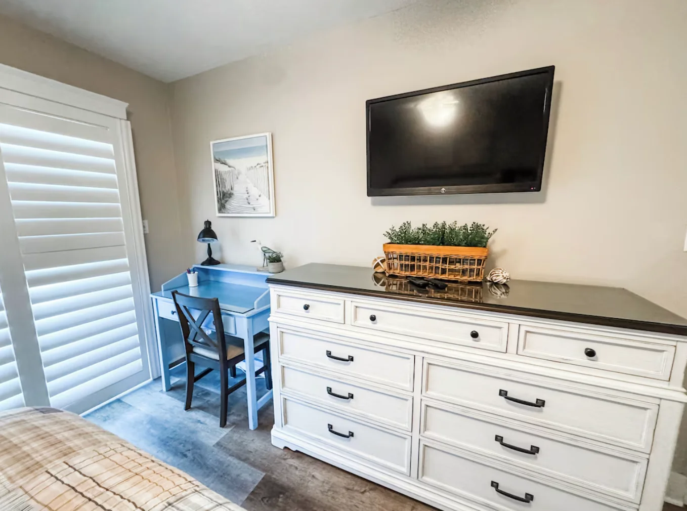 Main bedroom also includes a TV and a new desk/chair.