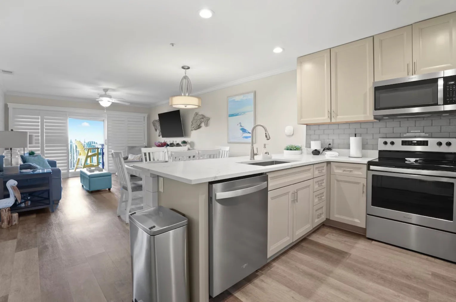 Newly updated kitchen with brand new countertop and stainless steel appliances. The kitchen is equipped with everything need to prepare meals.