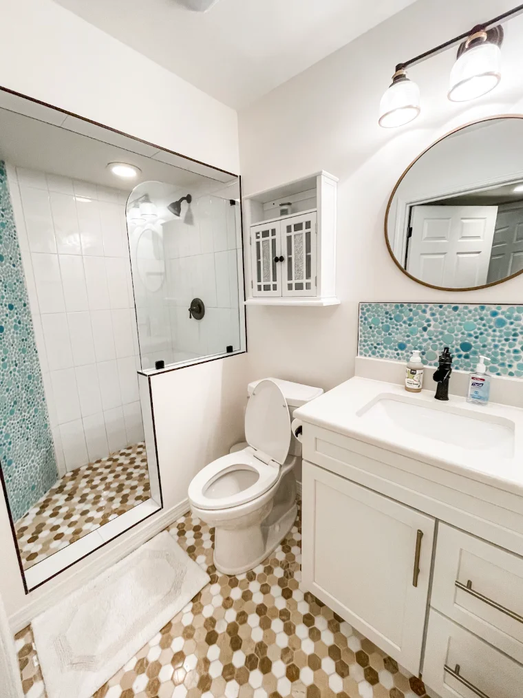 Guest bathroom features a walk in shower