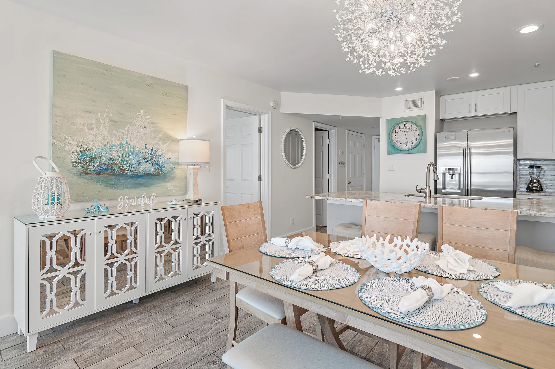 The luxurious light fixture in the Dining Room is dimmable & creates the perfect ambiance for a romantic evening!