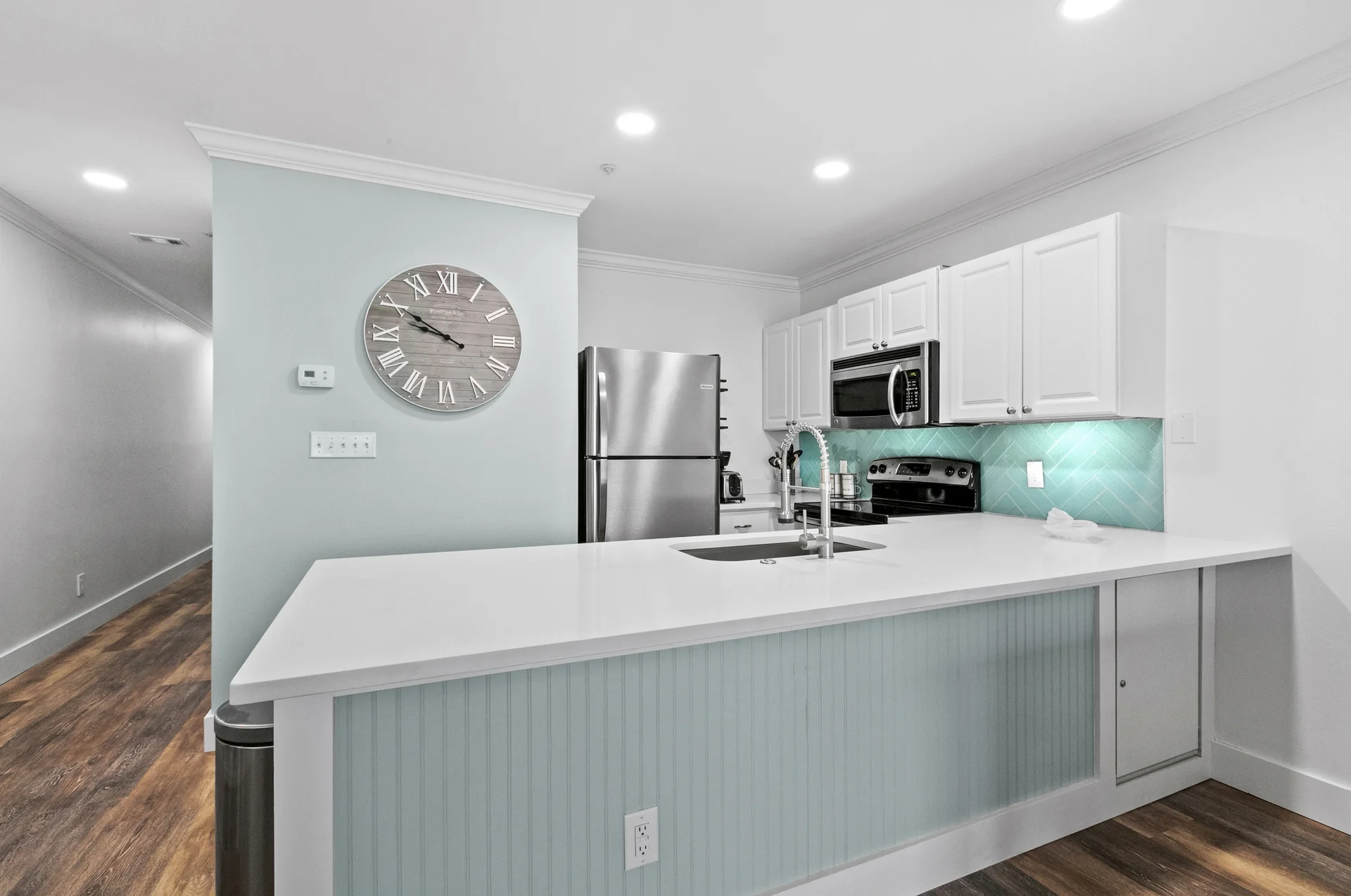 The well-stocked kitchen features a dishwasher, microwave, range and under-cabinet lighting, along with a full-size refrigerator with an ice maker. The kitchen is fully equipped with pots, pans, dishes, glassware, utensils and all the essentials needed for meal preparation