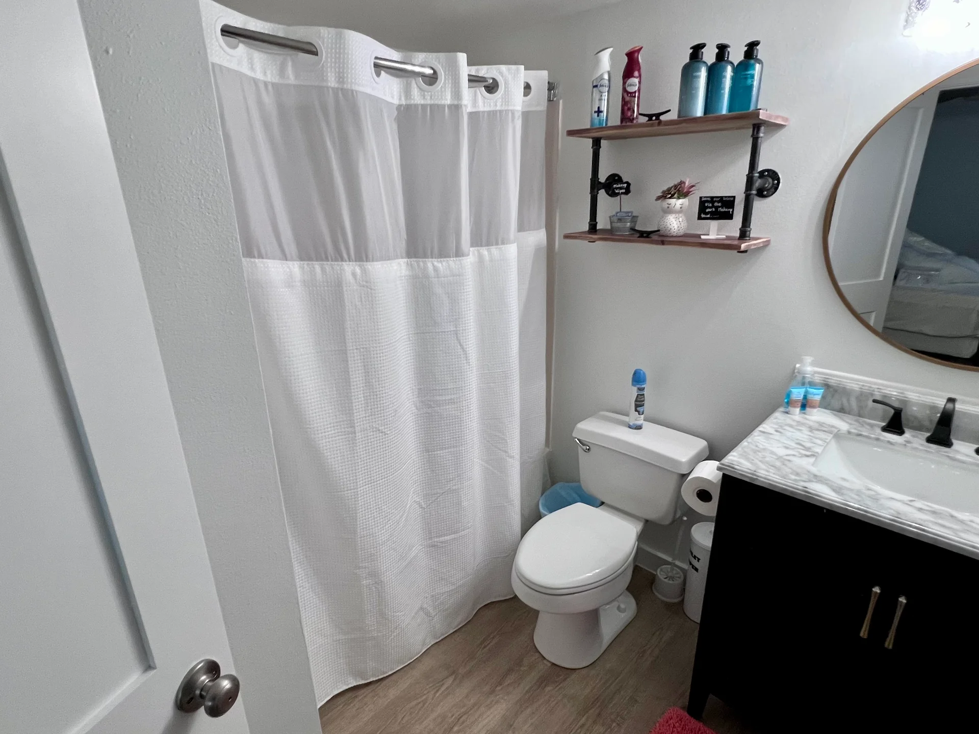 Full tub and shower in the bathroom adjoining the bedroom